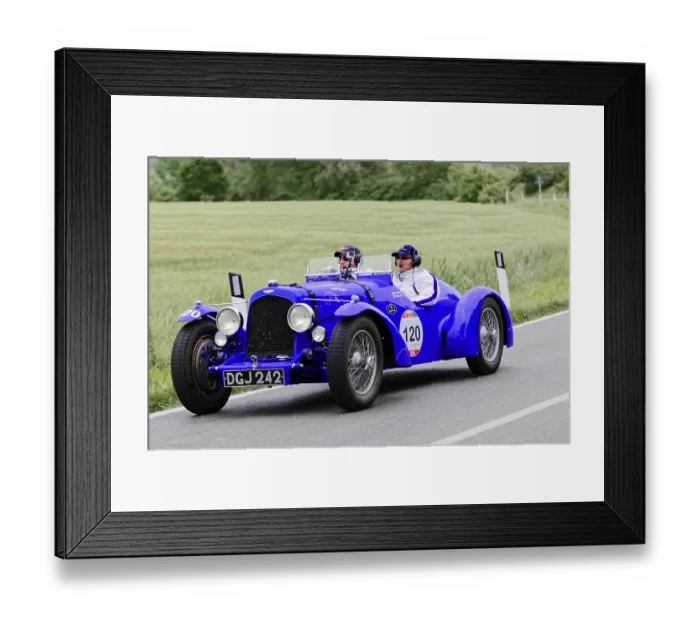 Framed Print : Blue racing gold car with two occupants on a country road Framed Print : Blue racing gold car with two occupants on a country road
