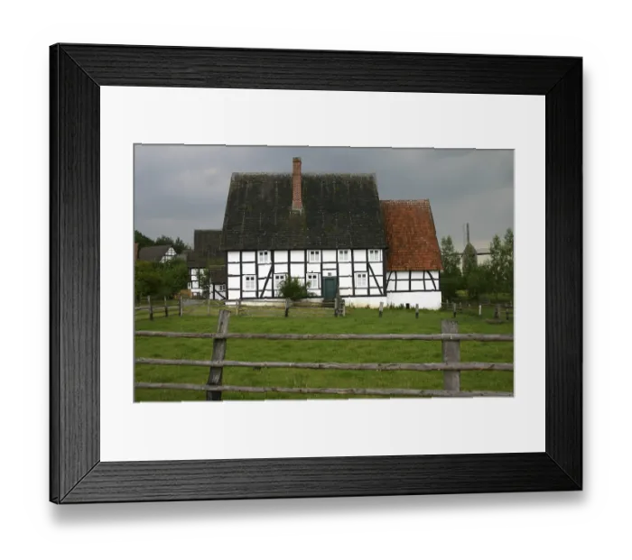 Framed Print : Half-timbered house under a stormy sky Framed Print : Half-timbered house under a stormy sky