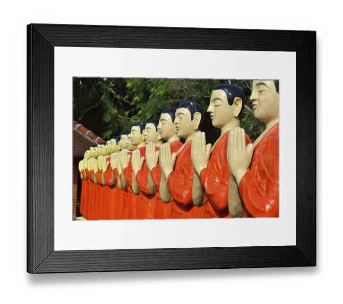 Framed Print : Figures of Buddhist monks in front of a monastery