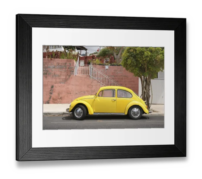 Framed Print : Yellow VW Beetle stands in front of red wall on the Canary Island La Palma