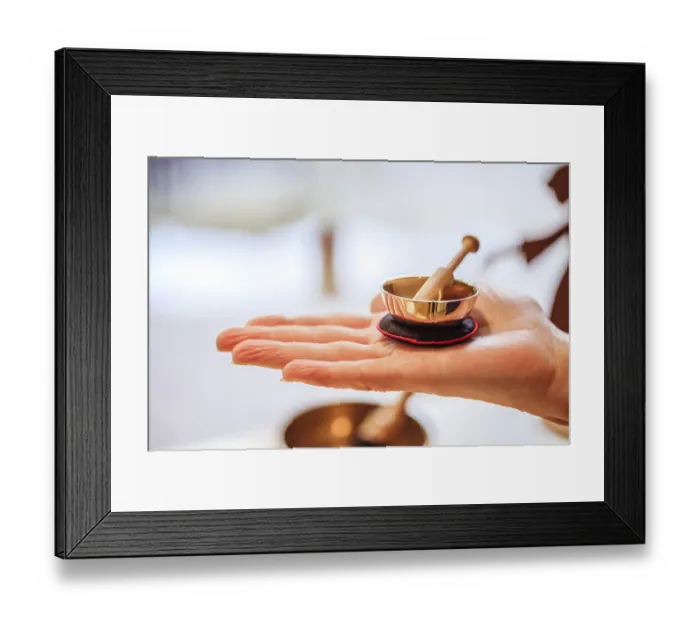 Framed Print : Small singing bowl holding in hand