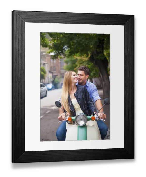 Framed Print : Happy young couple by a vintage scooter on the street Framed Print : Happy young couple by a vintage scooter on the street