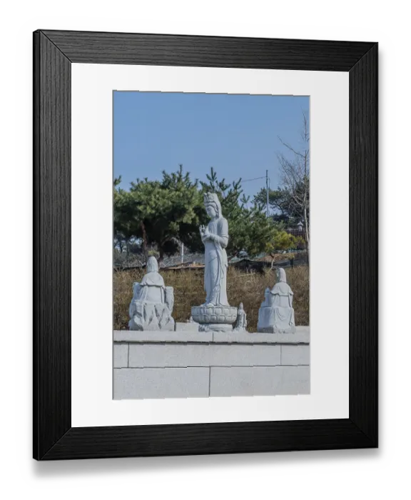 Framed Print : Standing stone carved Buddha in prayer under blue sky in Pyeongtaek Framed Print : Standing stone carved Buddha in prayer under blue sky in Pyeongtaek