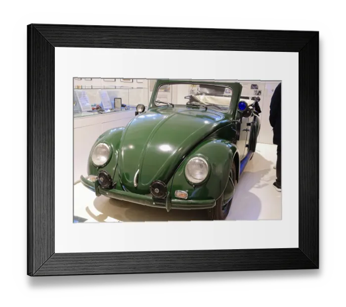 Framed Print : A green Volkswagen Beetle Cabriolet in shiny condition stands in the museum