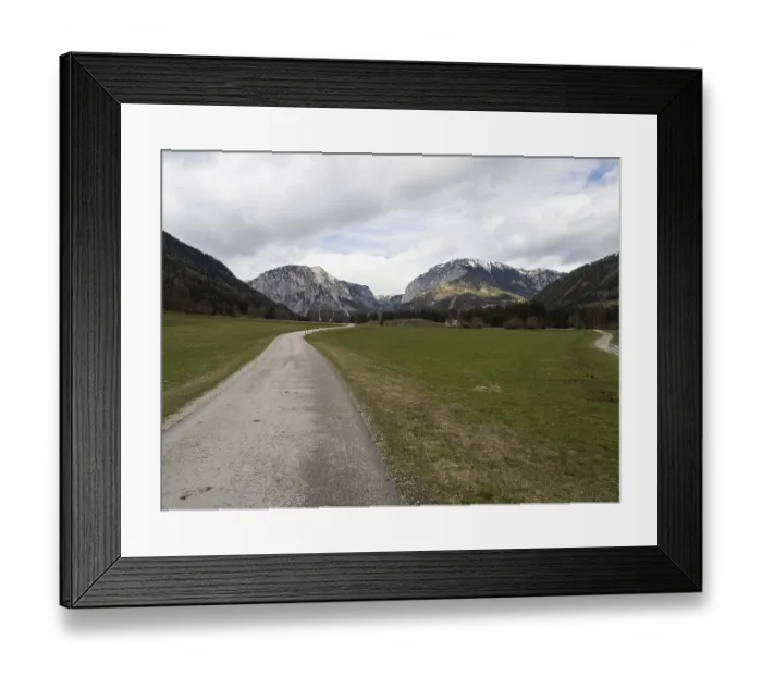 Framed Print : Country road in front of mountain panorama