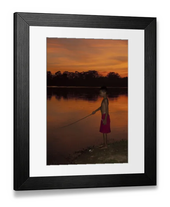 Framed Print : Young fishing in the lake at sunset Framed Print : Young fishing in the lake at sunset