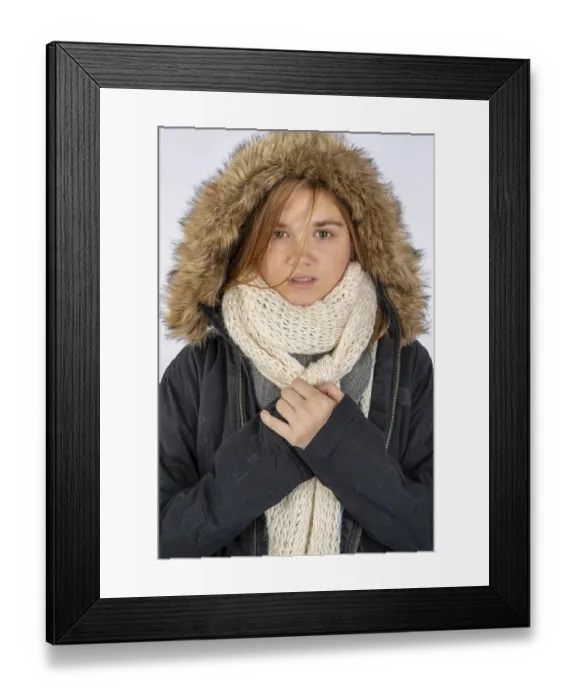 Framed Print : A beautiful blonde teenage model posing with a winter coat in a studio environment Framed Print : A beautiful blonde teenage model posing with a winter coat in a studio environment