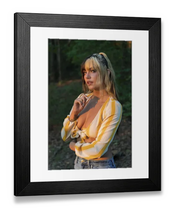 Framed Print : A gorgeous brunette model poses outdoors while enjoying the summer weather Framed Print : A gorgeous brunette model poses outdoors while enjoying the summer weather