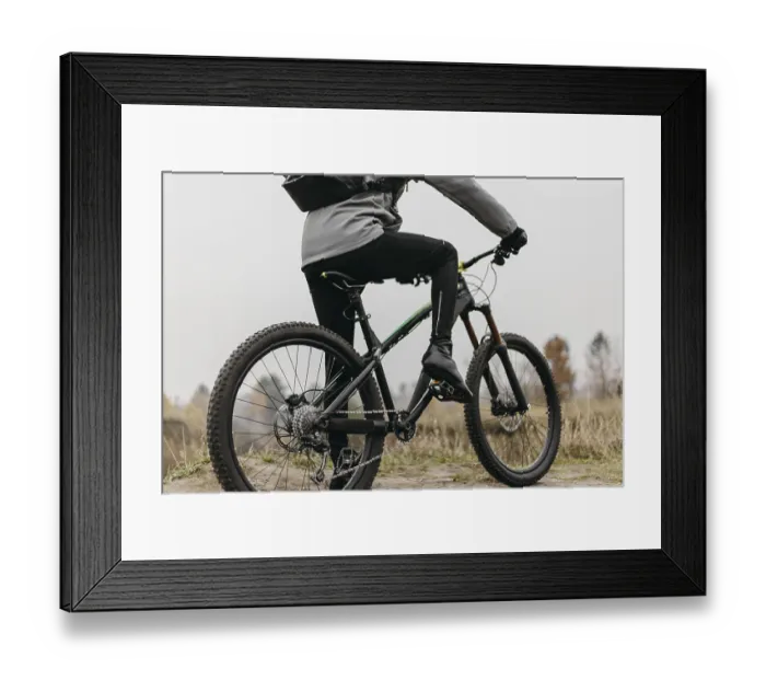 Framed Print : Front view man riding bike