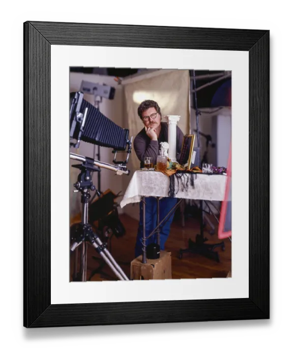 Framed Print : Photographer in a studio setting Framed Print : Photographer in a studio setting