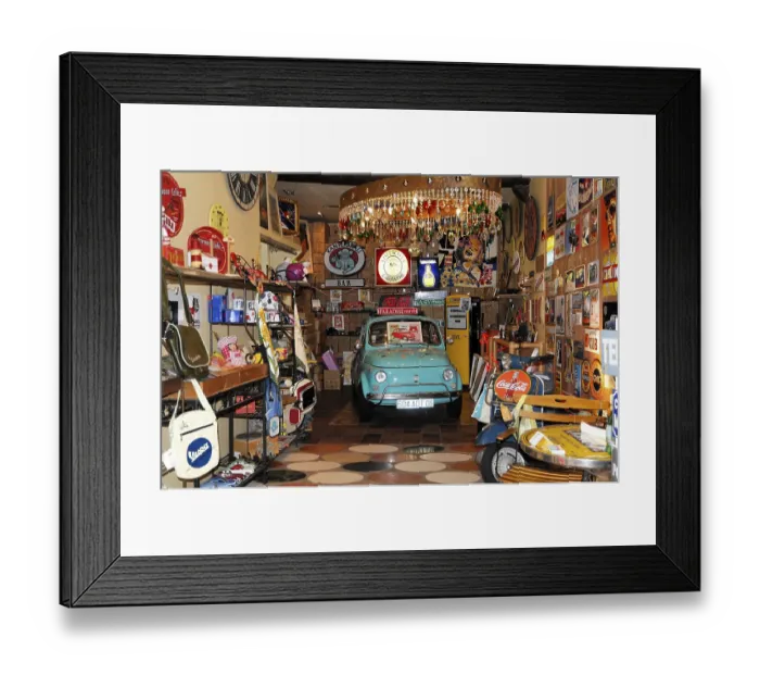 Framed Print : Vintage shop full of collector's items and an iconic vintage blue car