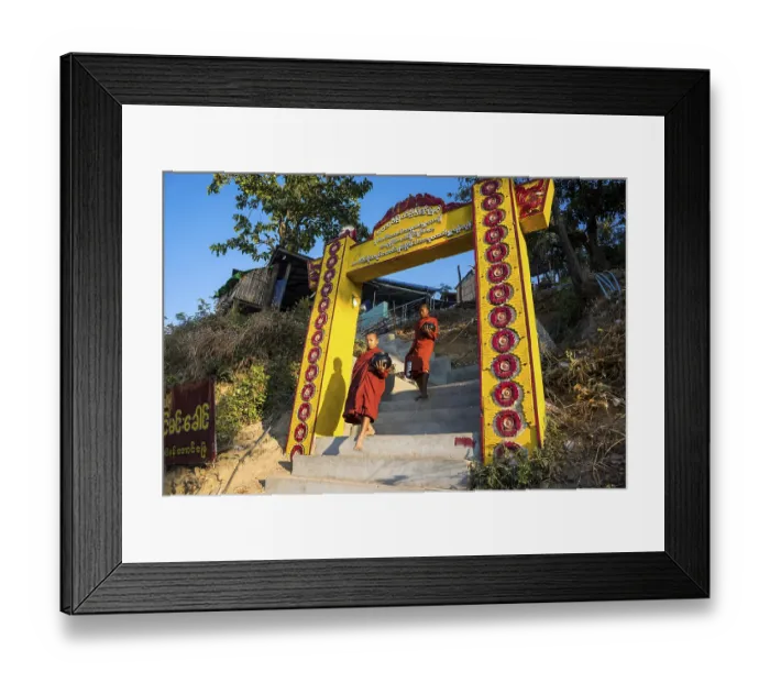 Framed Print : Buddhist novices with begging bowls at their morning begging tour