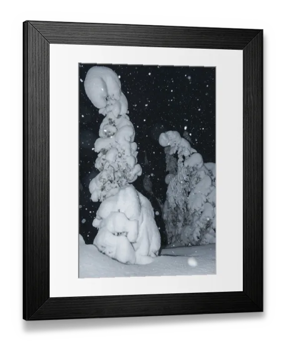 Framed Print : Snowfall in a snow-covered landscape