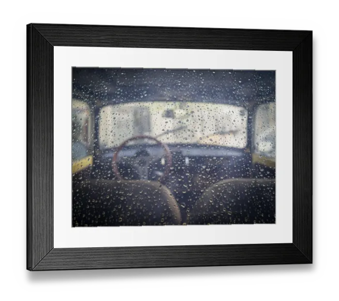 Framed Print : Rear window view into a classic oldtimmer with raindrops
