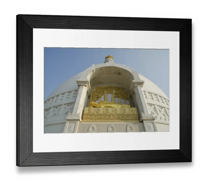 Framed Print : Sculpture of a golden reclining Buddha