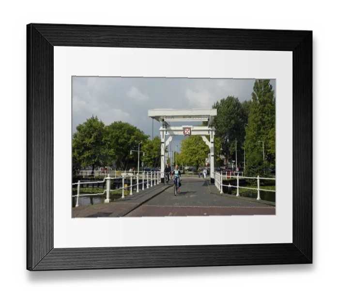 Framed Print : Cyclist on a bridge with the city coat of arms Framed Print : Cyclist on a bridge with the city coat of arms