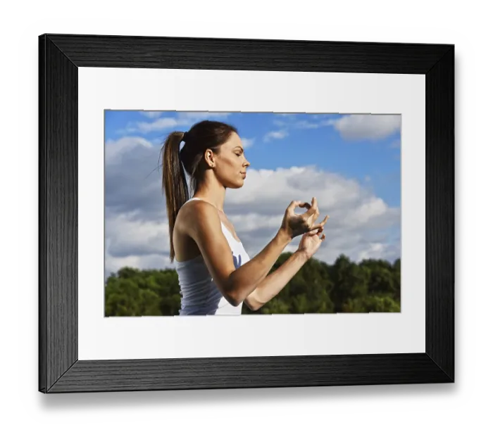 Framed Print : Young woman during yoga meditation in the park