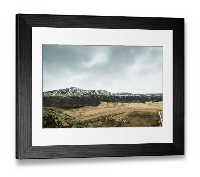 Framed Print : Iceland landscape in cloudy weather with fields and mountains Framed Print : Iceland landscape in cloudy weather with fields and mountains