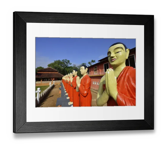 Framed Print : Figures of Buddhist monks in front of a monastery
