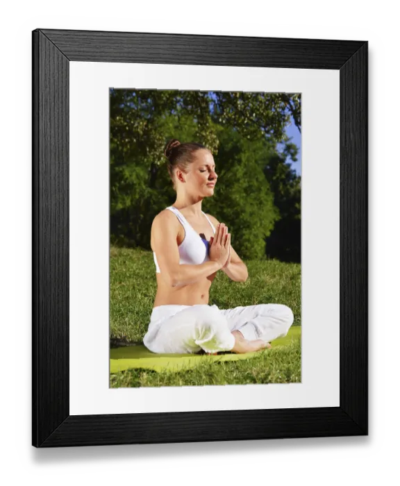 Framed Print : Young woman during yoga meditation in the park