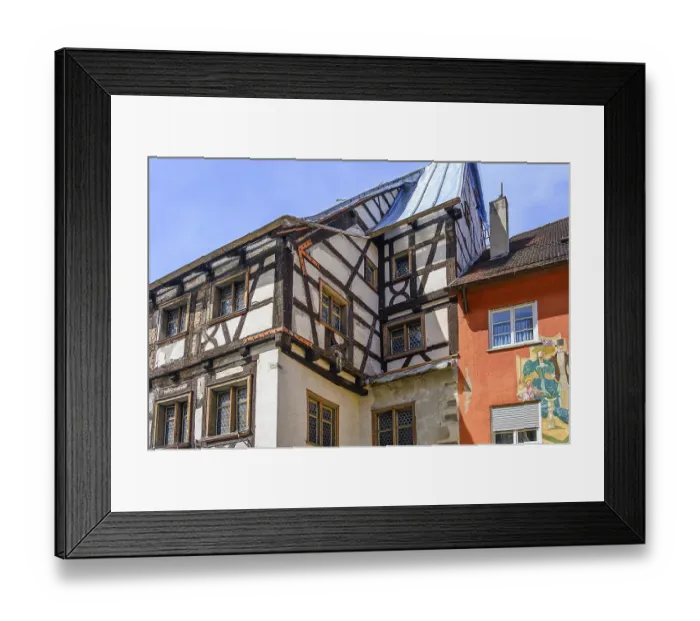 Framed Print : Half-timbered house from 1409 with bull's eye windows being renovated Framed Print : Half-timbered house from 1409 with bull's eye windows being renovated