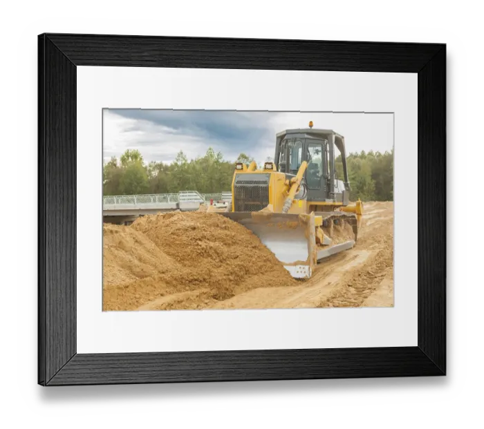 Framed Print : Bulldozer moves sand