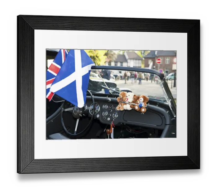 Framed Print : View through the windscreen of a classic car on a castle square