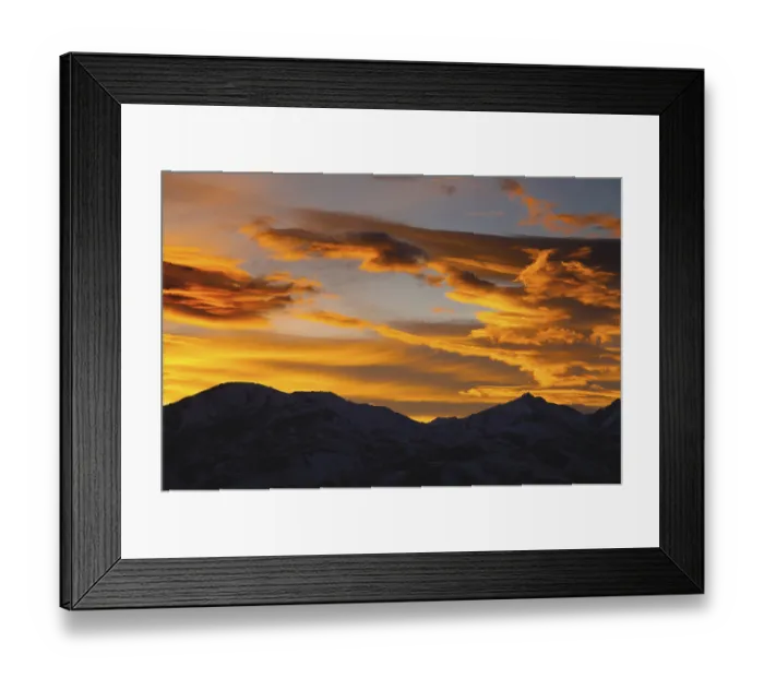 Framed Print : Mountains in the clouds at sunset in summer