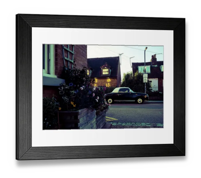 Framed Print : Vintage Nissan Figaro car, parked on the street