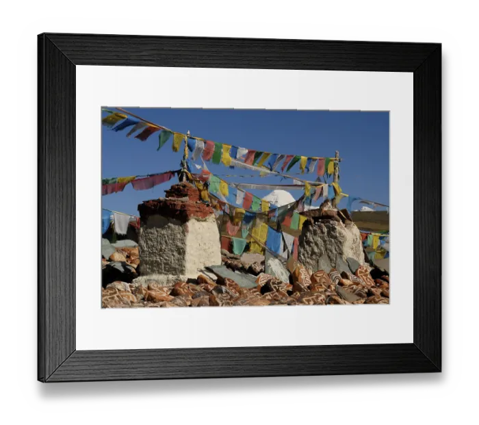 Framed Print : Prayer flags, mani stones and chorten of Chiu Gompa monastery in front of snow-covered Mount Kailash