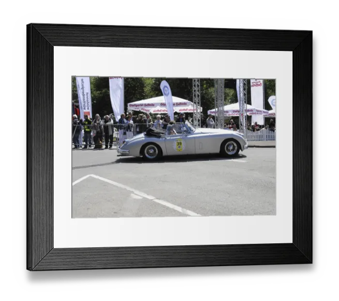 Framed Print : A classic convertible takes part in a classic car race