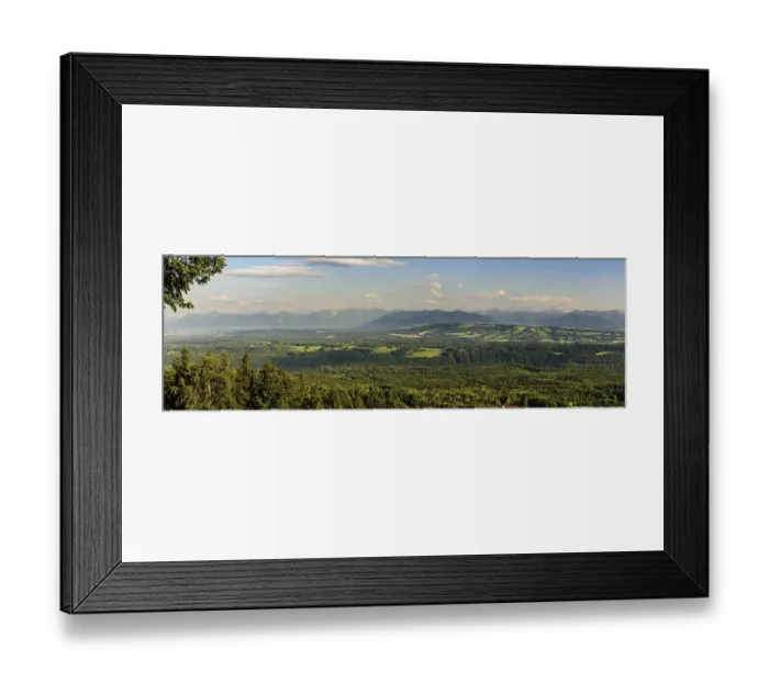 Framed Print : Panoramic view of an idyllic landscape with mountains in the background and extensive forests in the foreground Framed Print : Panoramic view of an idyllic landscape with mountains in the background and extensive forests in the foreground