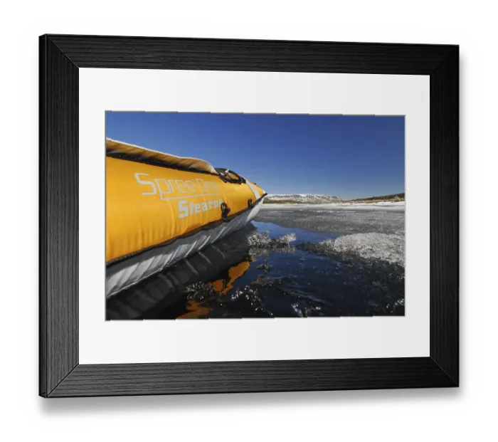 Framed Print : Side of a kayak reflected on a lake with ice floes Framed Print : Side of a kayak reflected on a lake with ice floes