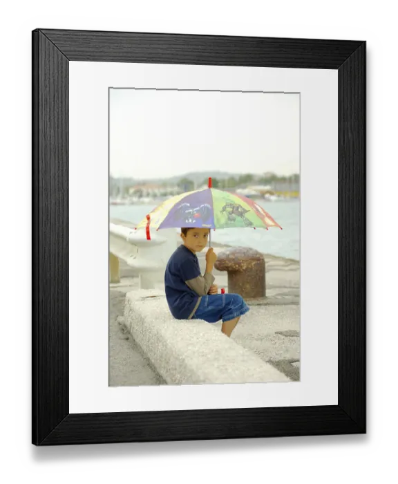 Framed Print : Boy with umbrella at pier, Pesaro, umbrella, Italy