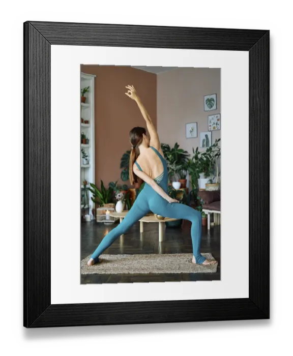Framed Print : Young slim woman practicing yoga doing reverse warrior pose Framed Print : Young slim woman practicing yoga doing reverse warrior pose