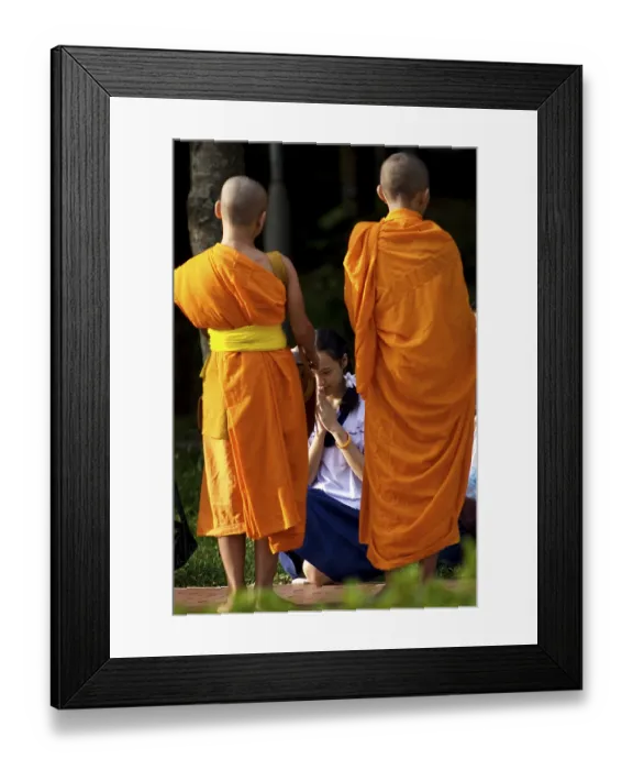 Framed Print : Buddhist monks in the early morning tradition of gathering alms in Chiang Mai