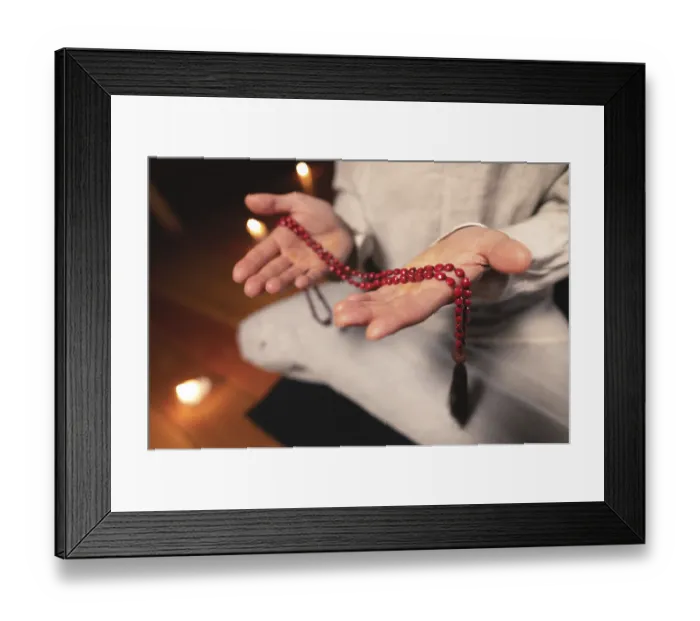 Framed Print : Close-up man in clothes for practice and meditation sits in a lotus pose Framed Print : Close-up man in clothes for practice and meditation sits in a lotus pose