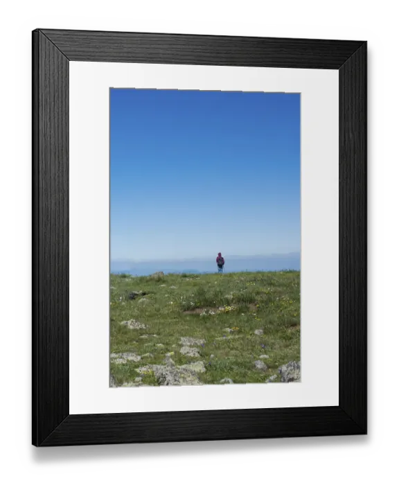 Framed Print : Young man taking an excursion on a mountain