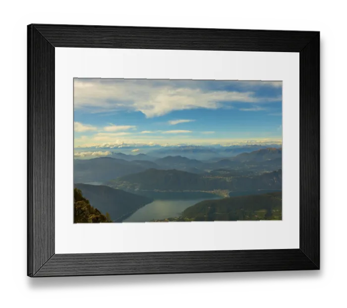 Framed Print : Aerial View over Beautiful Mountainscape with Clouds and Lake Lugano in a Sunny Day From Monte Generoso Framed Print : Aerial View over Beautiful Mountainscape with Clouds and Lake Lugano in a Sunny Day From Monte Generoso