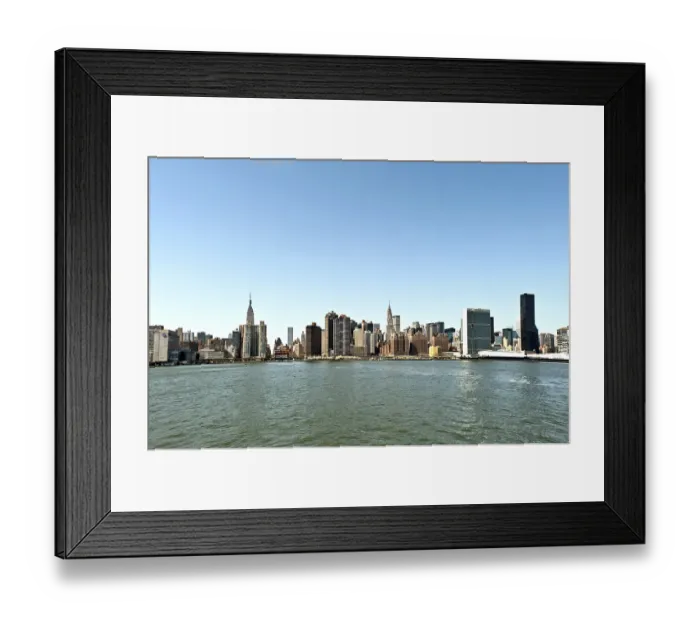 Framed Print : View of the east side of Manhattan from the ferry across the East River