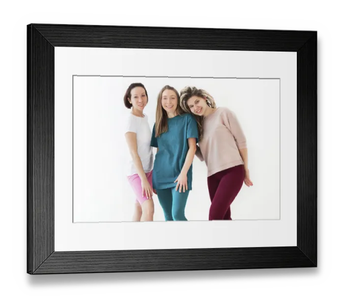Framed Print : Happy young women smiling after meditating against white wall during yoga session