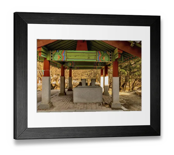 Framed Print : Rear view of covered water cistern with dragon head fountains at Buddhist temple