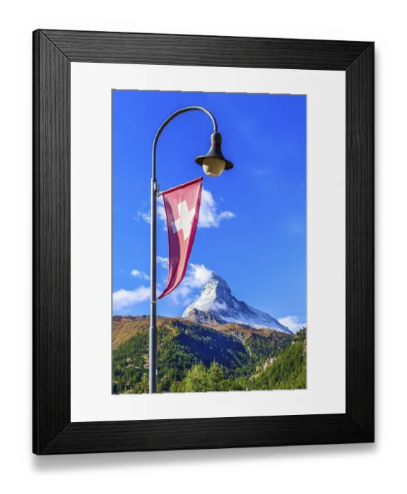 Framed Print : Matterhorn snow mount, Swiss flag and street light close-up