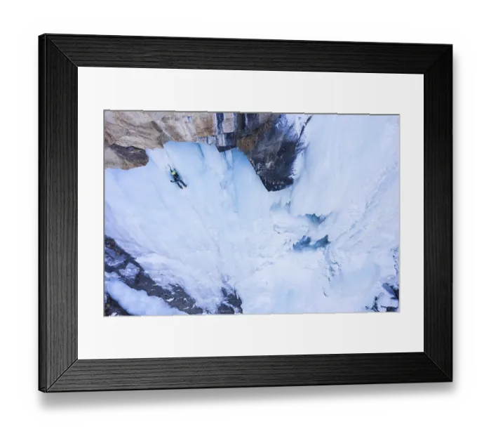 Framed Print : Man is leading on Ice. Ice Climbing on Frozen Waterfall Framed Print : Man is leading on Ice. Ice Climbing on Frozen Waterfall