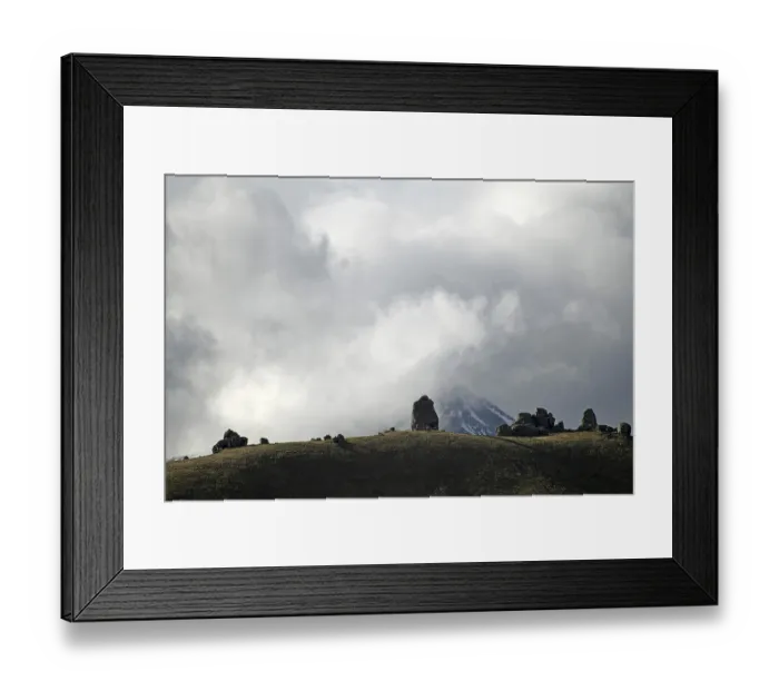 Framed Print : Cloud formations waft over the rocky landscape at Castle Hill