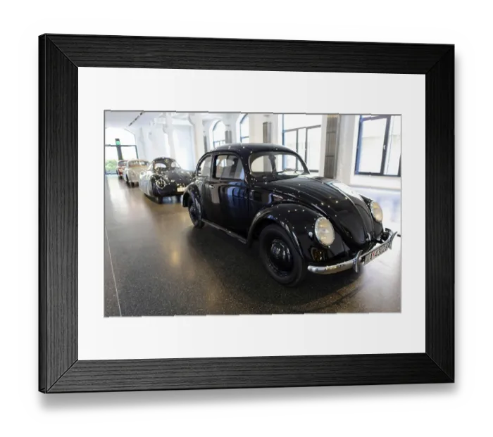 Framed Print : Classic black Volkswagen Beetle in a bright showroom Framed Print : Classic black Volkswagen Beetle in a bright showroom