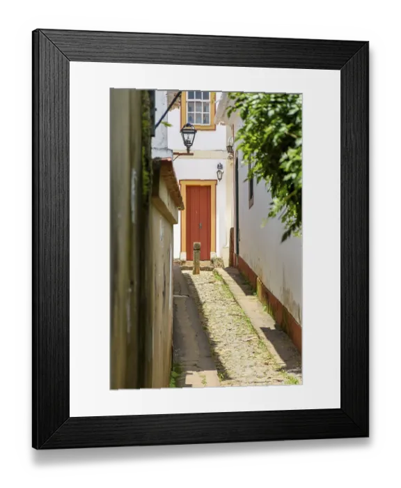 Framed Print : Alley with old houses in colonial architecture and cobbled street in the city of Tiradentes