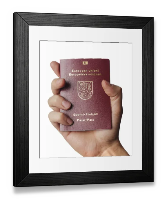 Framed Print : Hand holding a new biometric Finnish passport