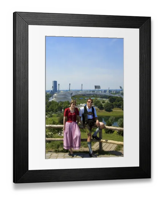 Framed Print : Couple in Bavarian traditional costume in front of Olympic Stadium Framed Print : Couple in Bavarian traditional costume in front of Olympic Stadium
