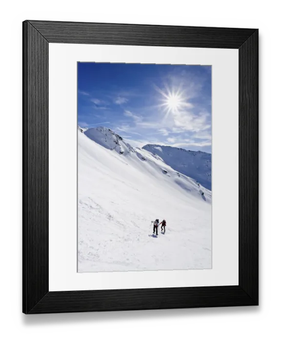 Framed Print : Snowshoers climbing Mt. Hoertlahner above Durnholz